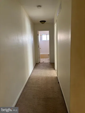 a view of hallway with windows