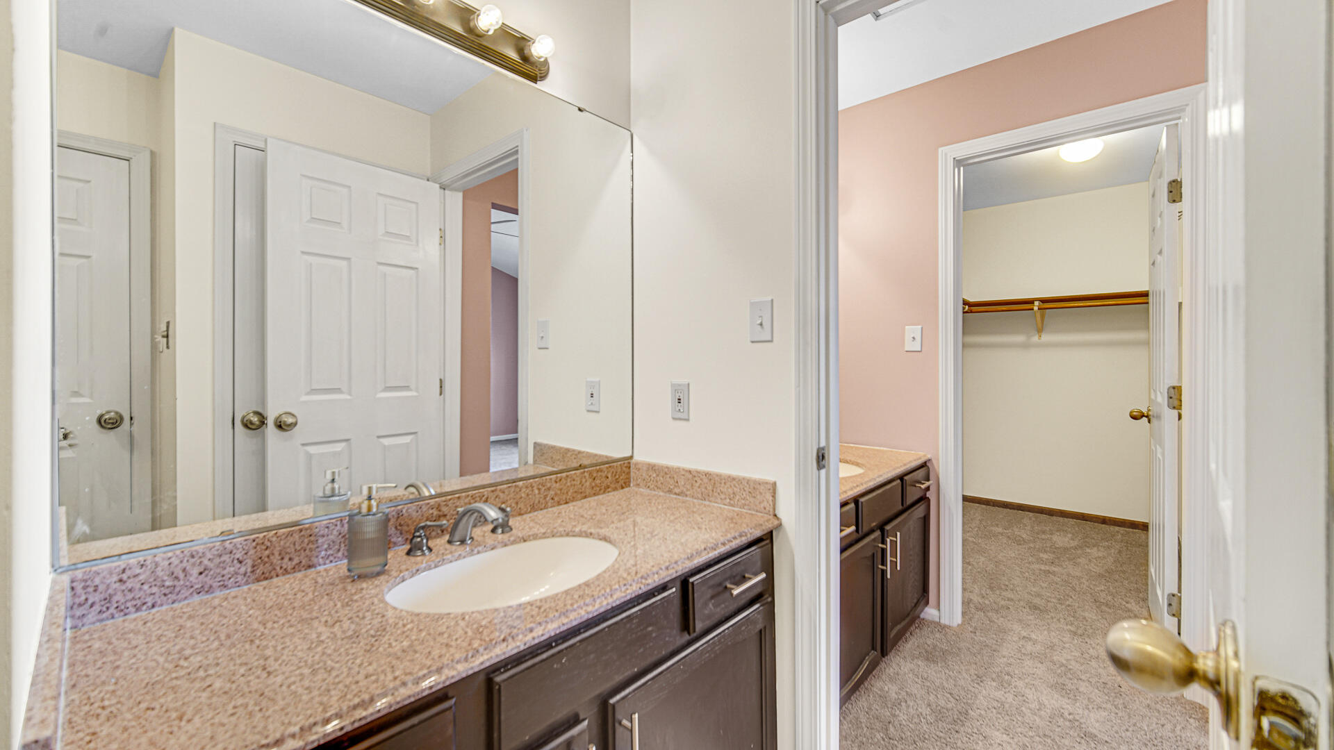 771 Kenmare Parkway Crown Point, IN 46307 - Photo 16 of 20 a bathroom with a granite countertop sink and a mirror