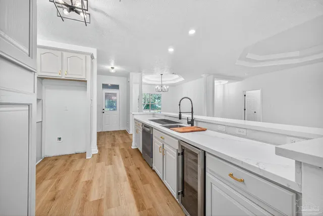 a view of a hallway with wooden floor and closet