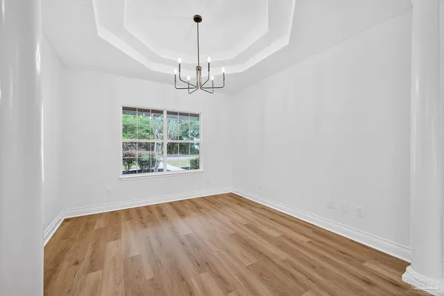 a spacious bathroom with a granite countertop sink a toilet and shower