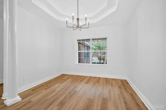 a spacious bathroom with a granite countertop sink and a mirror