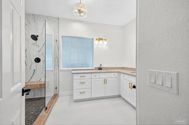 an empty room with wooden floor ceiling fan and windows