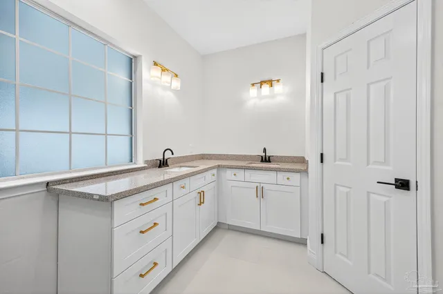 a bathroom with a sink and mirror