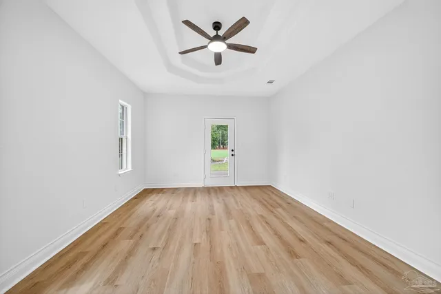 a view of hallway with wooden floor