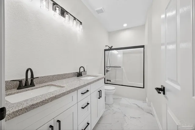 a view of an empty room with windows