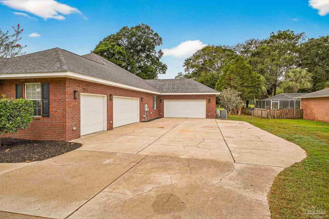 a front view of a house with a big yard