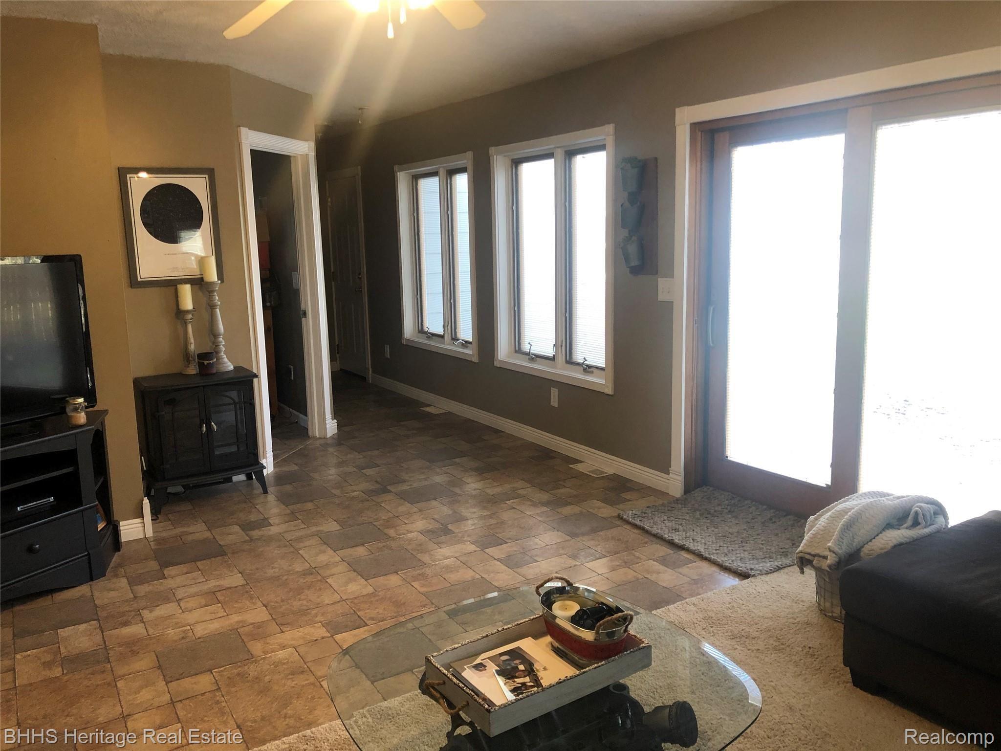 4564 Van Atta Road Okemos, MI 48864 - Photo 15 of 21 family room open to backyard