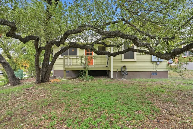 a view of a balcony with wooden floor