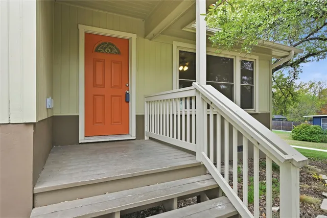 a view of a house with porch and wooden floor