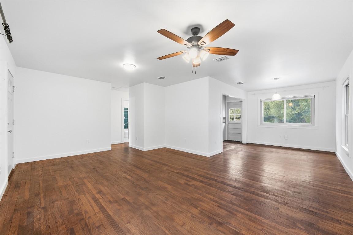 1003 Cogbill Street, Unit 1 Austin, TX 78745 - Photo 5 of 15 wooden floor in an empty room with a window