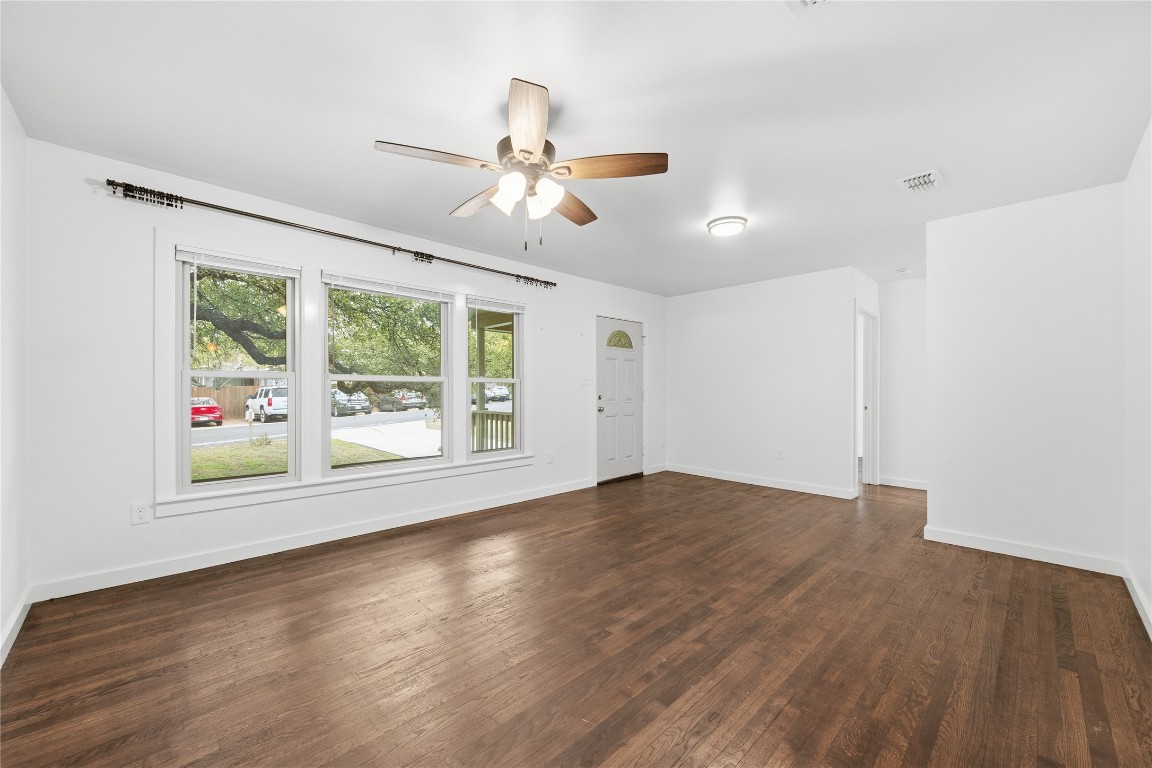 1003 Cogbill Street, Unit 1 Austin, TX 78745 - Photo 6 of 15 a view of an empty room with wooden floor and a window