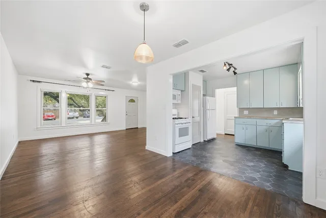 a house that has a tree in front of it