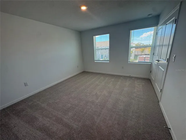 an empty room with windows