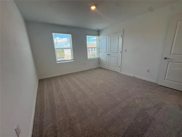 a bathroom with a double vanity sink and mirror