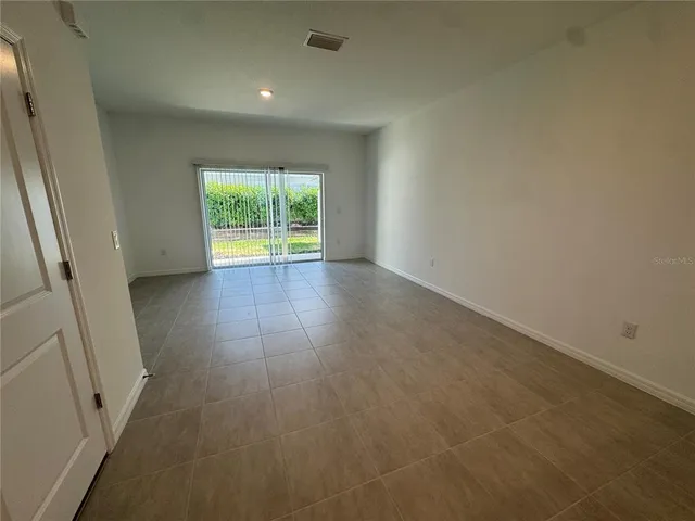 en empty room with windows