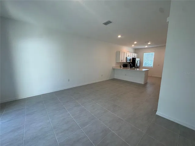 a view of a kitchen and a window