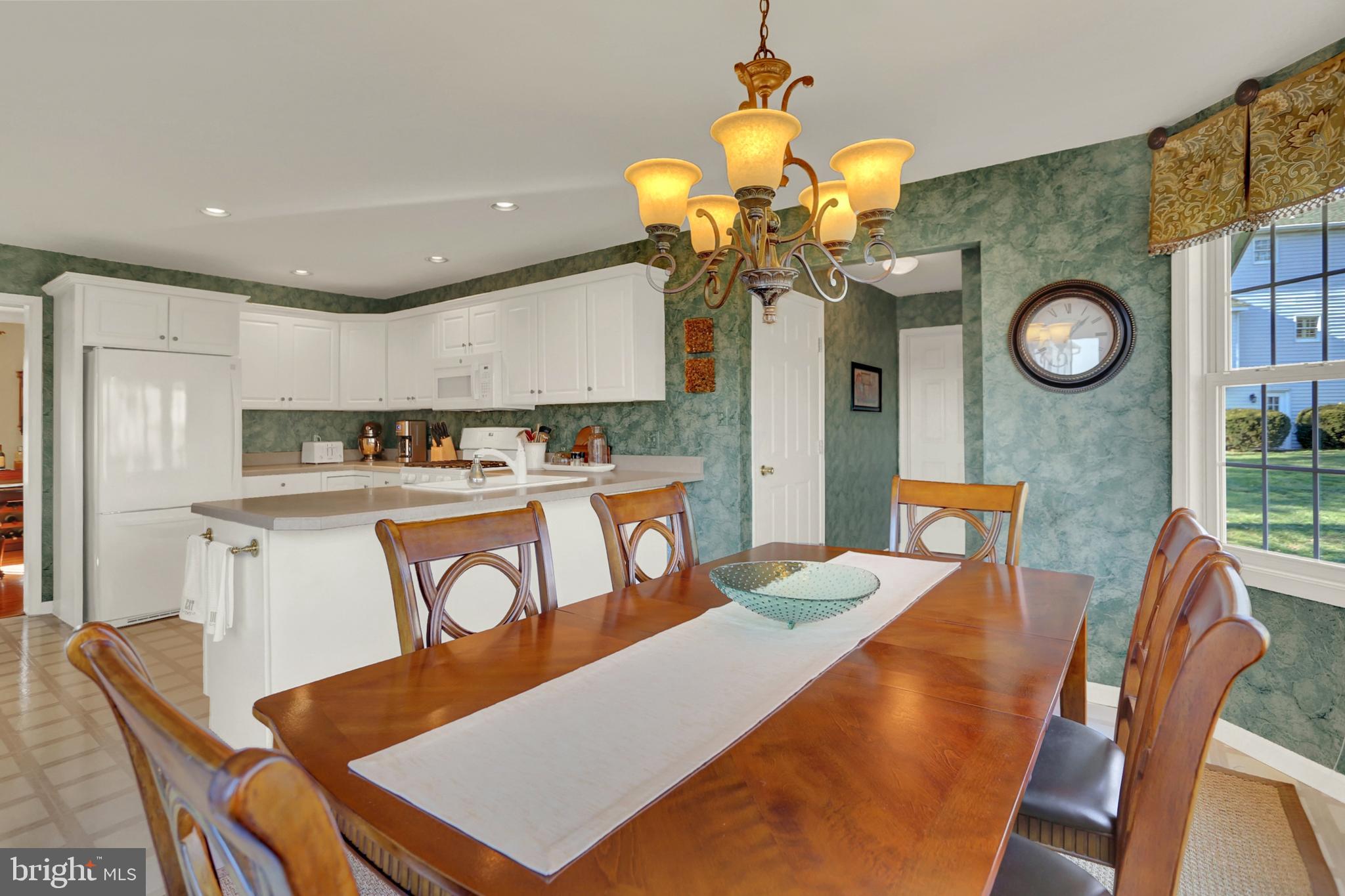 402 Hidden Valley Road New Cumberland, PA 17070 - Photo 15 of 50 a view of a dining room with furniture and chandelier