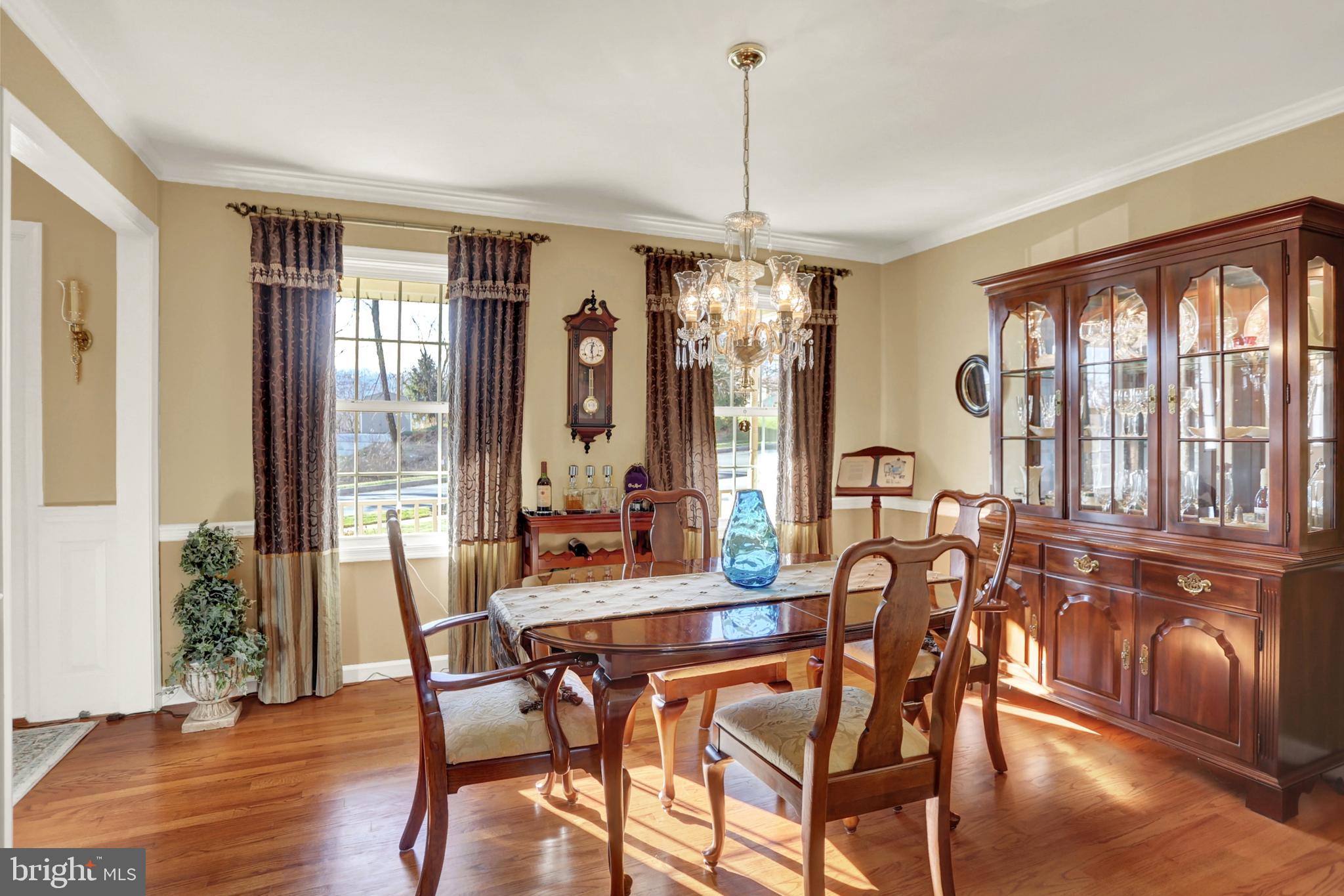 402 Hidden Valley Road New Cumberland, PA 17070 - Photo 17 of 50 a view of a dining room with furniture window and wooden floor
