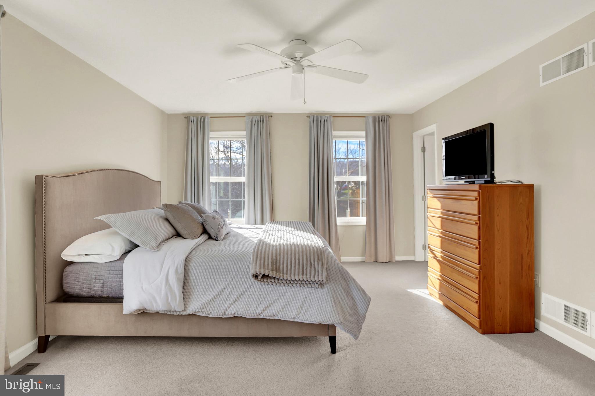 402 Hidden Valley Road New Cumberland, PA 17070 - Photo 23 of 50 a bedroom with a bed and a flat screen tv