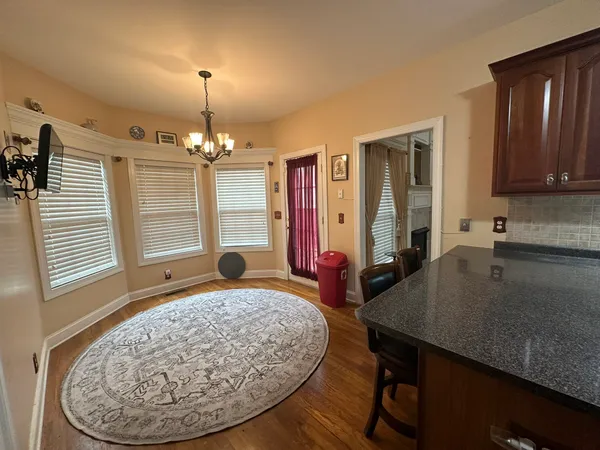 a very nice looking dining room with a table and chairs