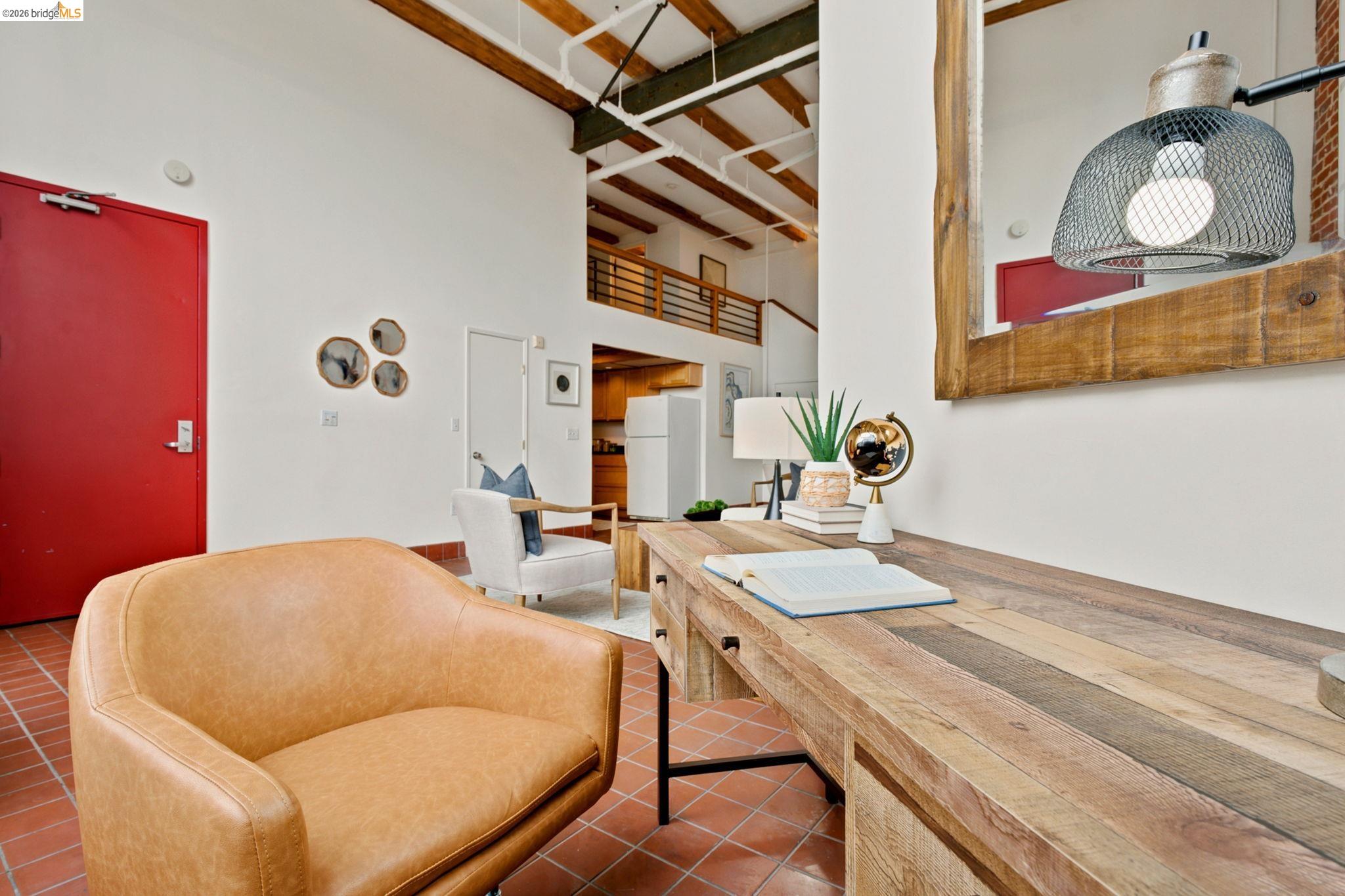 1920 Union Street, Unit 9 Oakland, CA 94607 - Photo 11 of 35 Interior workspace featuring a natural wood-finish desk, exposed beam ceilings, and terracotta tile flooring