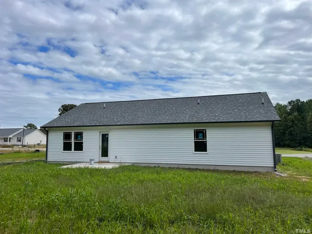 a backyard of a house with lots of green space