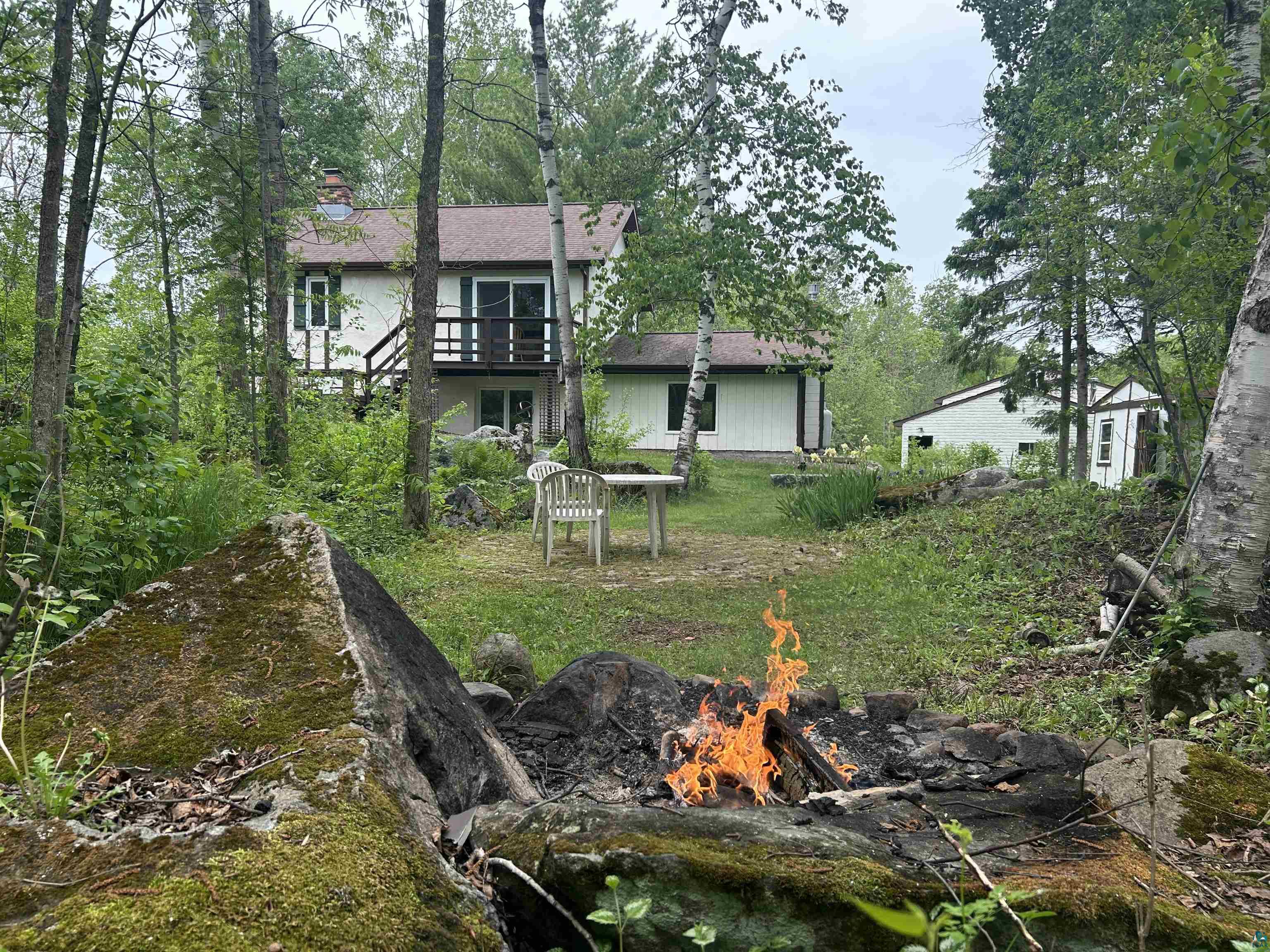 3616 Lavaque Road Hermantown, MN 55811 - Photo 1 of 43 Wooded property featuring a multi-level dwelling with an upper-level balcony