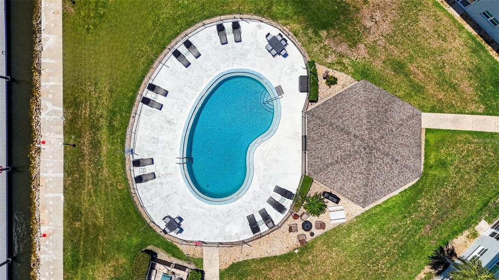 5197 Silent Loop, Unit 124 New Port Richey, FL 34652 - Photo 44 of 55 an aerial view of a house with swimming pool and outdoor seating