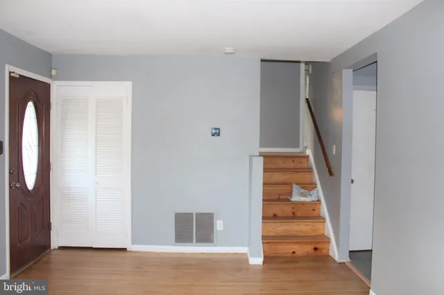 a view of entryway with wooden floor