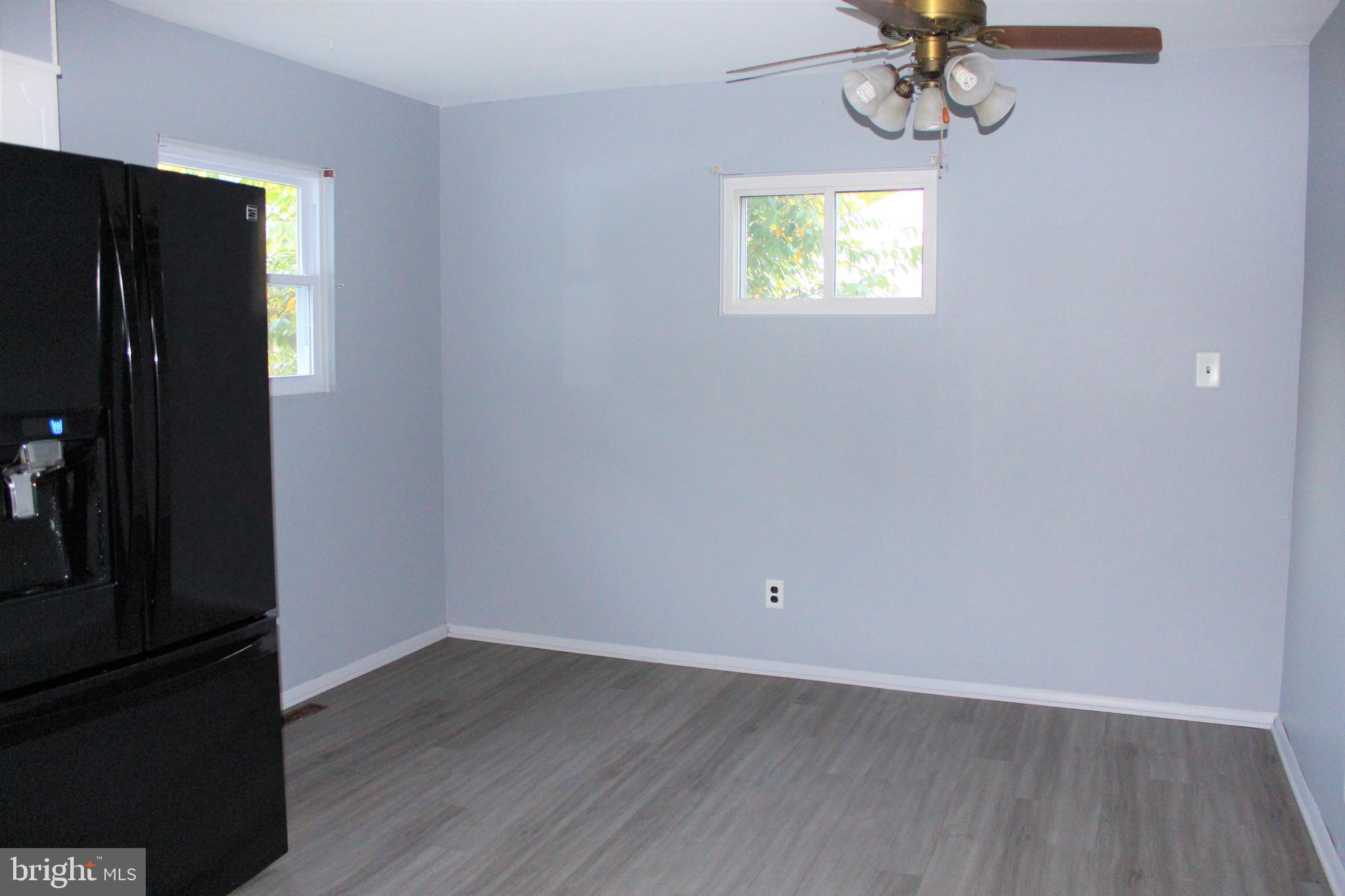 413 Dickinson Road Glassboro, NJ 08028 - Photo 7 of 16 an empty room with a window