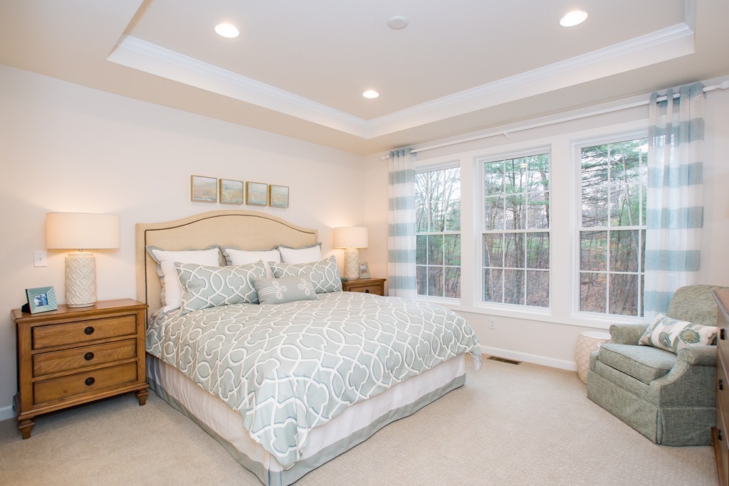 40 Sienna Circle, Unit 53 Upton, MA 01568 - Photo 9 of 10 a bedroom with a bed and a couch