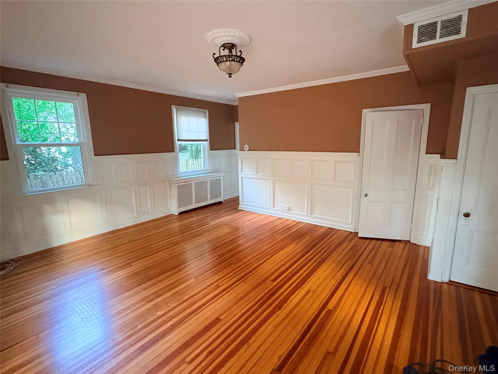 6 Tower Road Glen Cove, NY 11542 - Photo 6 of 12 a bedroom with a bed and a window