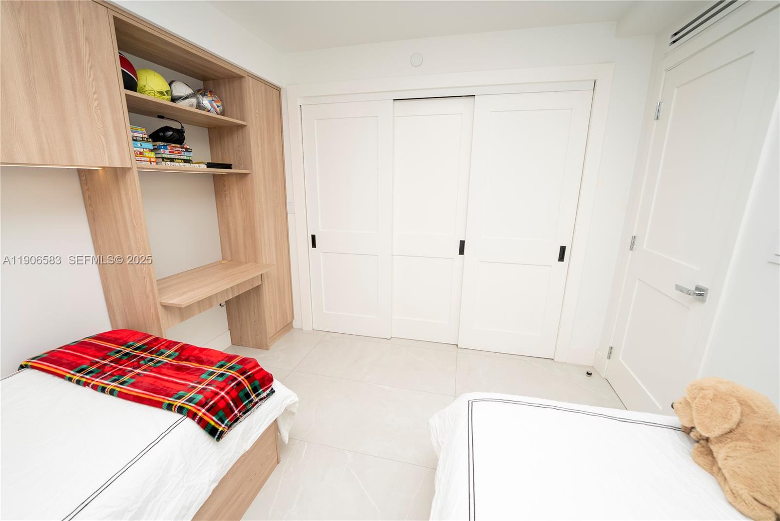 881 Ocean Drive, Unit TH15 Key Biscayne, FL 33149 - Photo 11 of 26 a bedroom with a bed and a cabinets