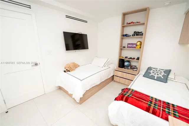 a bathroom with a double vanity sink mirror double and shower