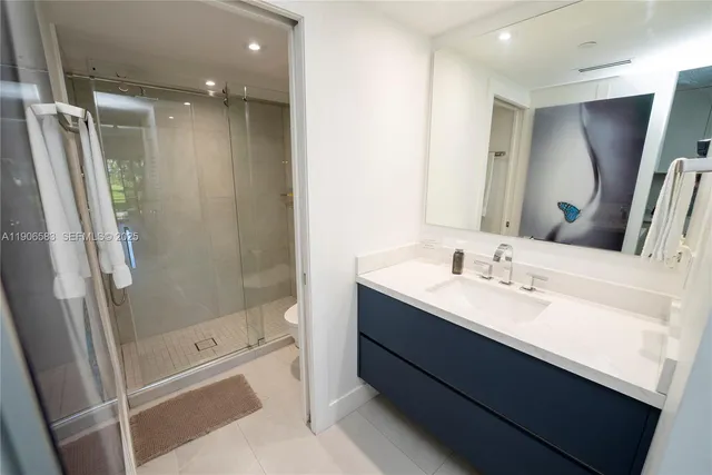 a living room with a large window and a flat screen tv