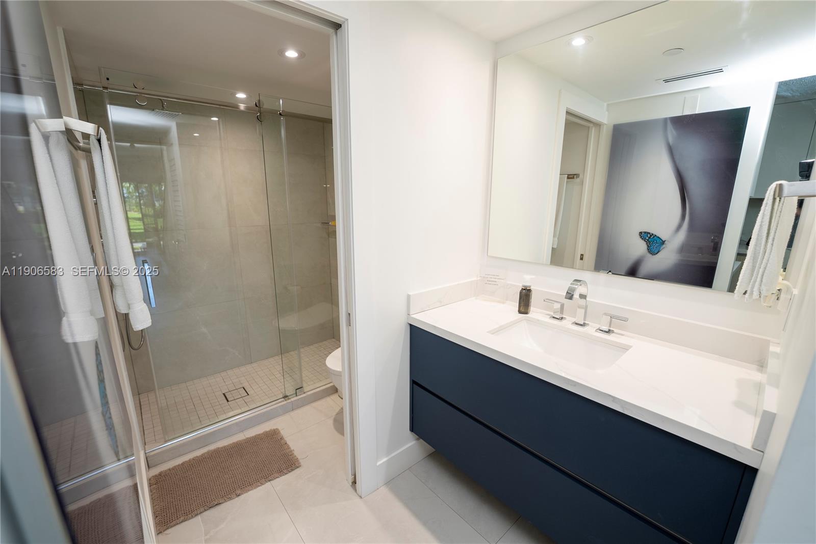 881 Ocean Drive, Unit TH15 Key Biscayne, FL 33149 - Photo 13 of 26 a bathroom with a double vanity sink mirror double and shower