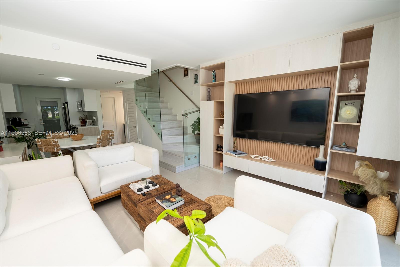 881 Ocean Drive, Unit TH15 Key Biscayne, FL 33149 - Photo 16 of 26 a living room with furniture and a flat screen tv