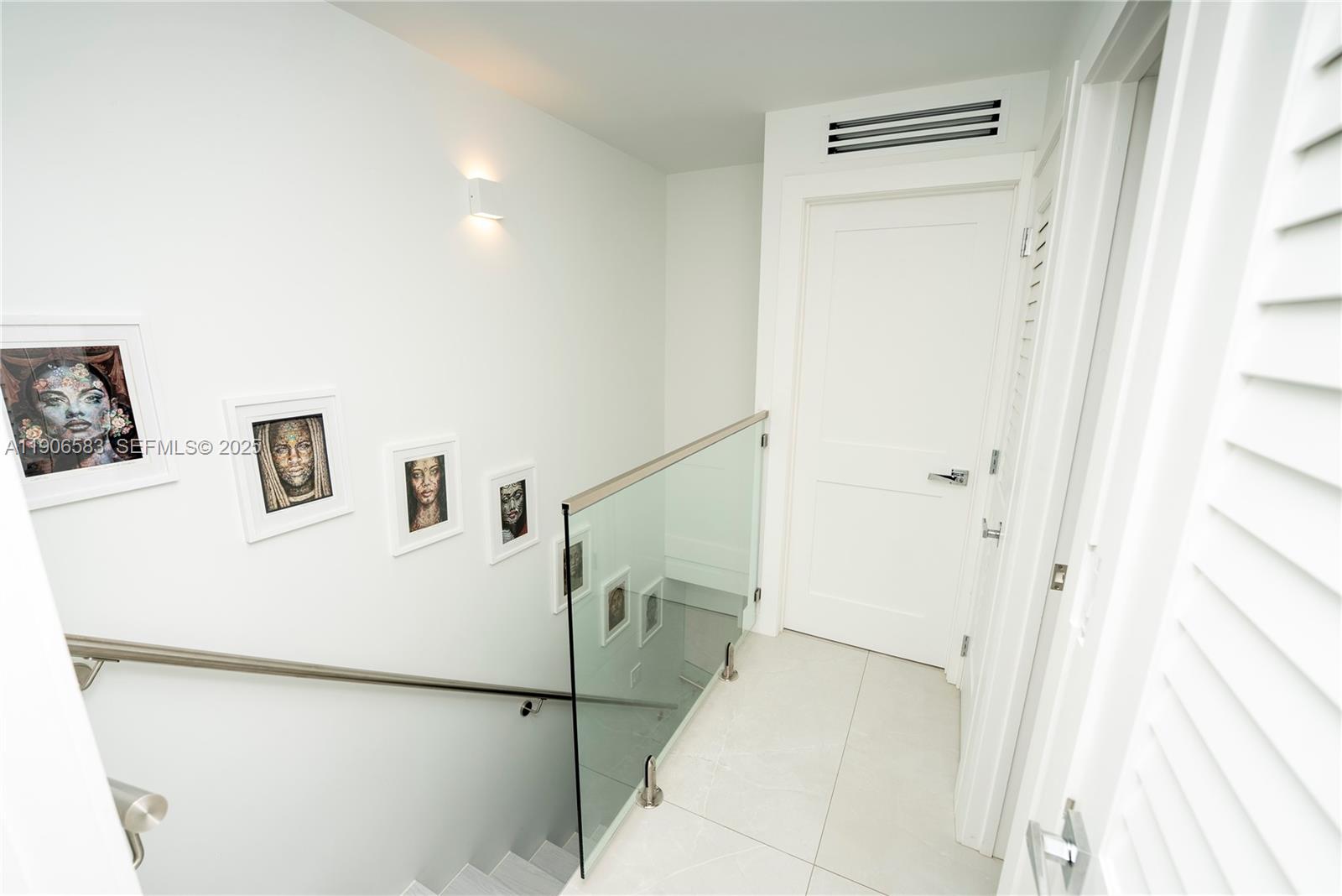 881 Ocean Drive, Unit TH15 Key Biscayne, FL 33149 - Photo 18 of 26 a view of a hallway with workspace