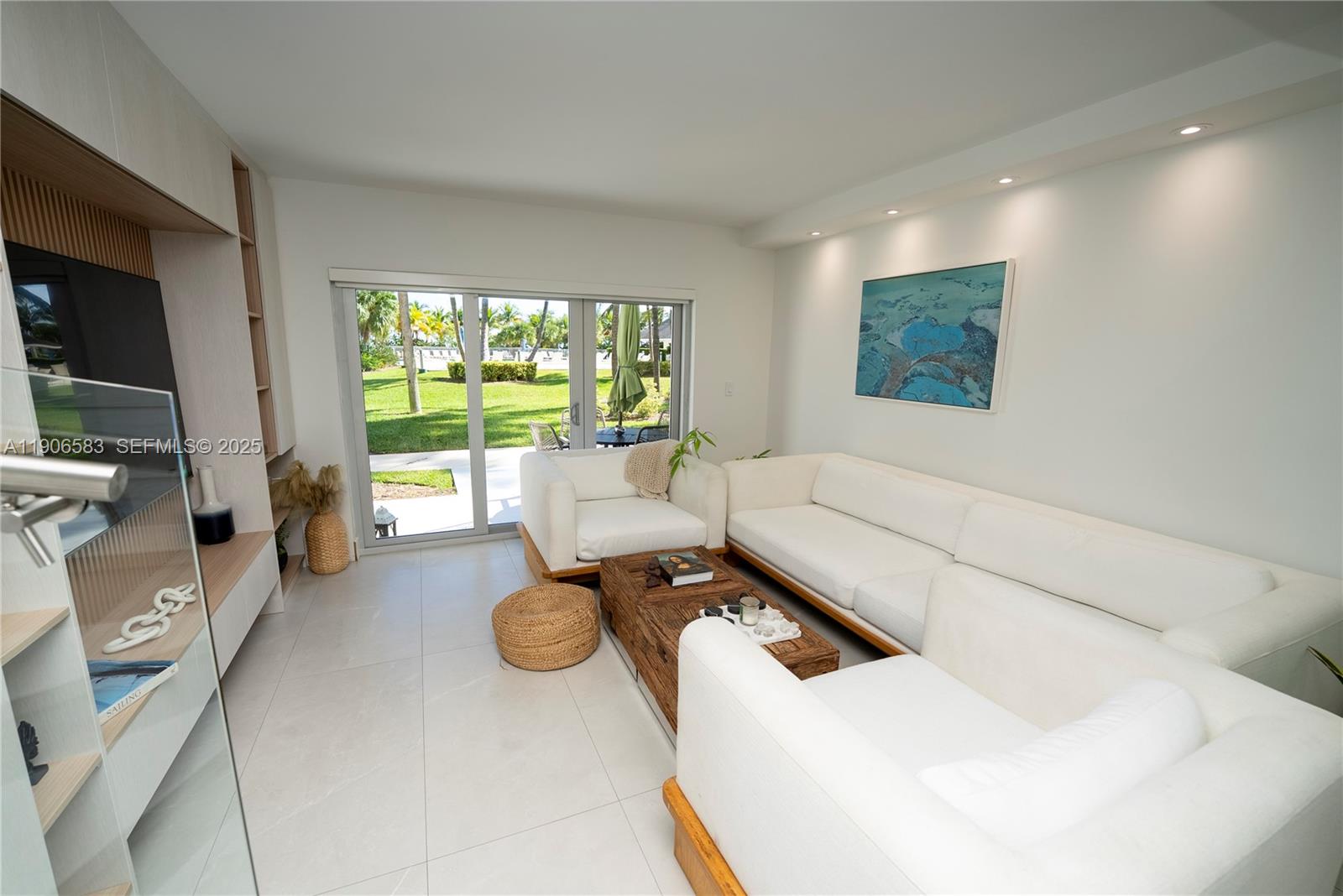 881 Ocean Drive, Unit TH15 Key Biscayne, FL 33149 - Photo 21 of 26 a living room with furniture and a flat screen tv