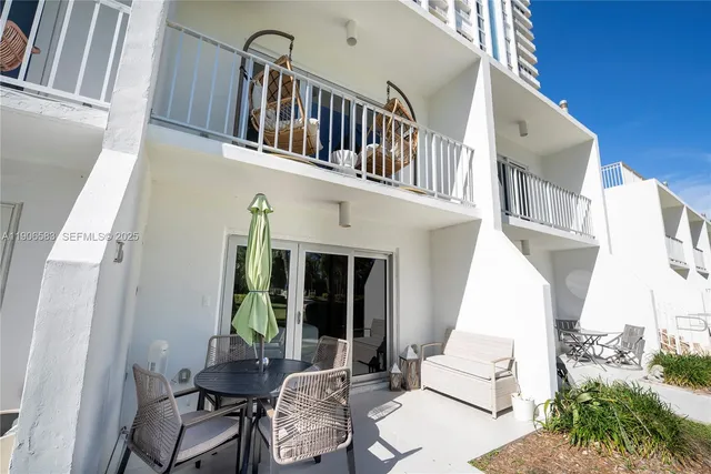 a view of swimming pool with outdoor seating and plants