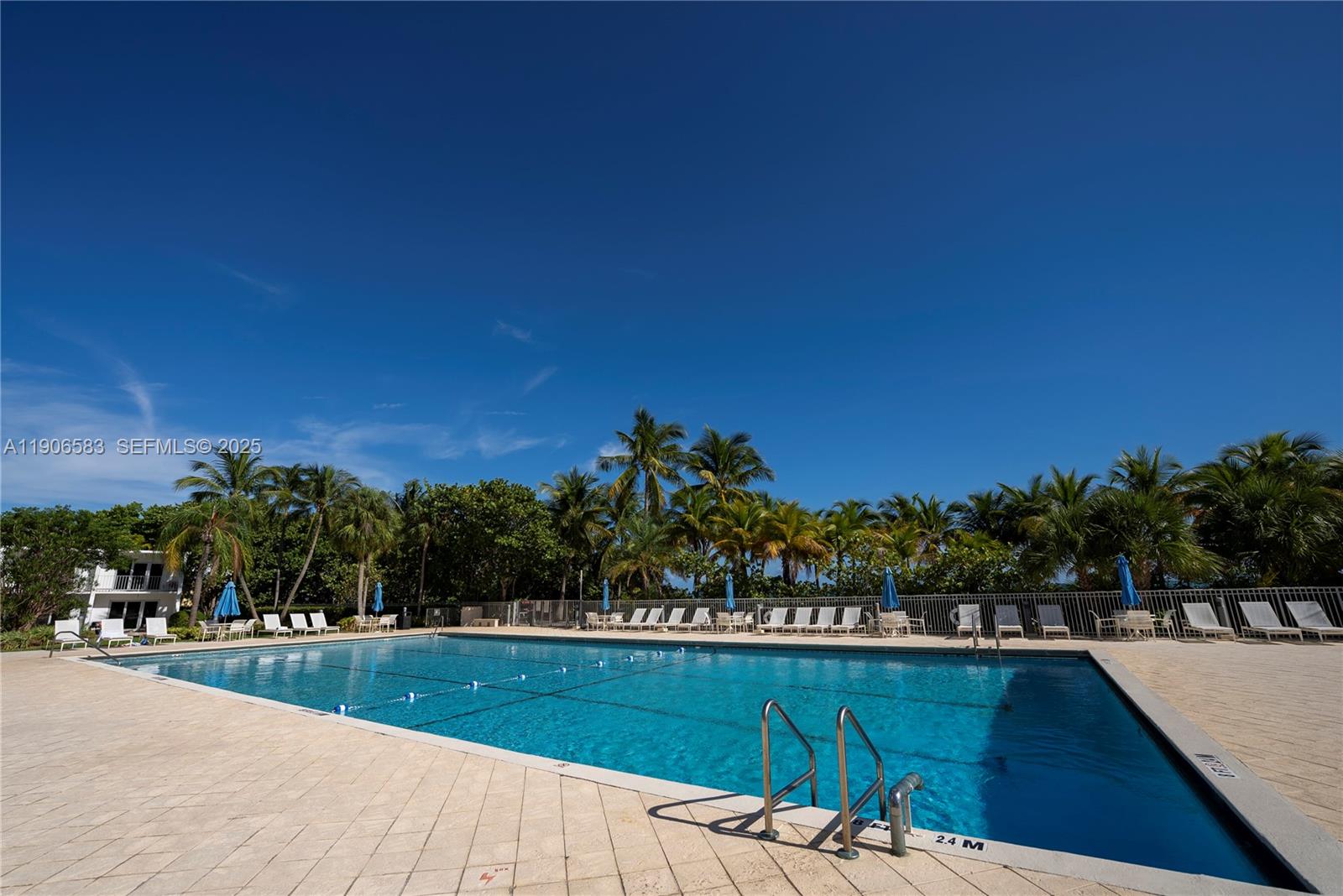 881 Ocean Drive, Unit TH15 Key Biscayne, FL 33149 - Photo 24 of 26 a view of swimming pool with outdoor seating and plants