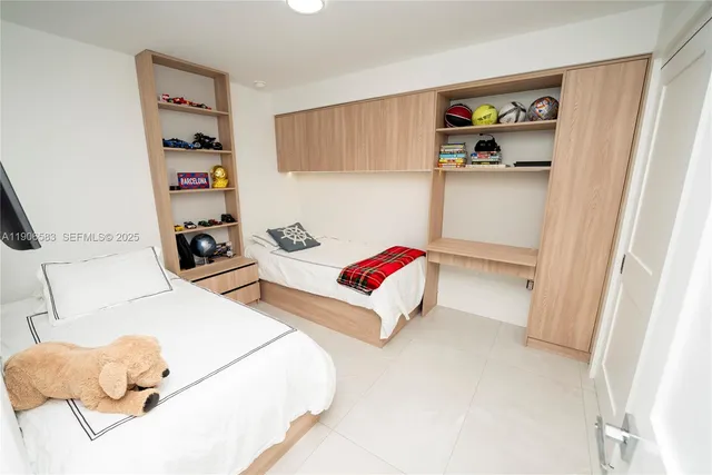 a bedroom with a bed and a cabinets