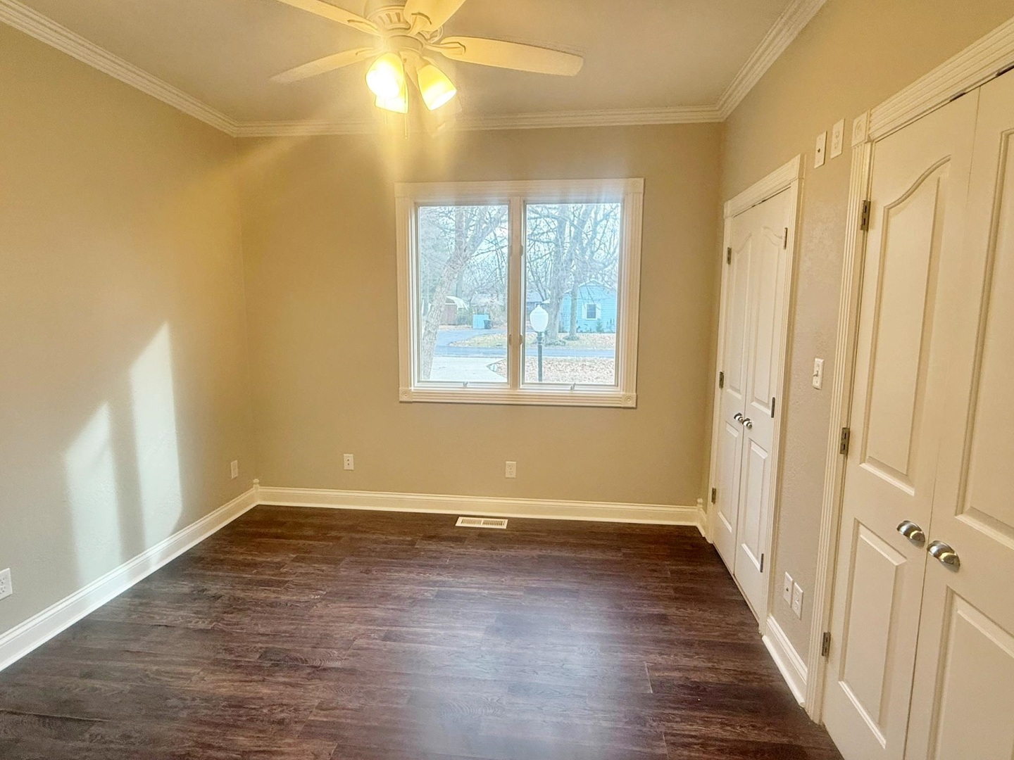 9 Hickory Lane Metropolis, IL 62960 - Photo 17 of 37 a view of an empty room with wooden floor and a window