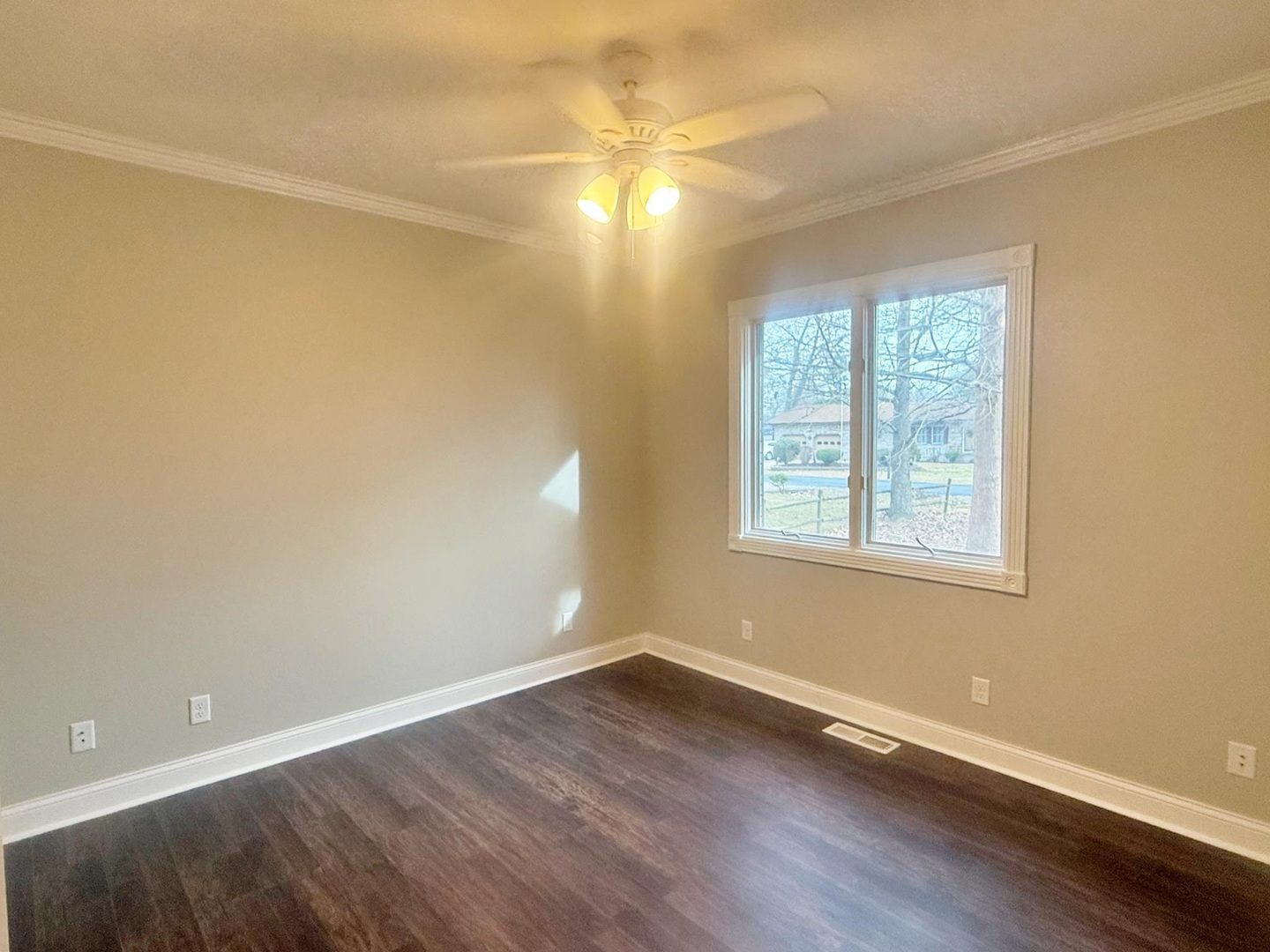 9 Hickory Lane Metropolis, IL 62960 - Photo 19 of 37 an empty room with wooden floor and windows