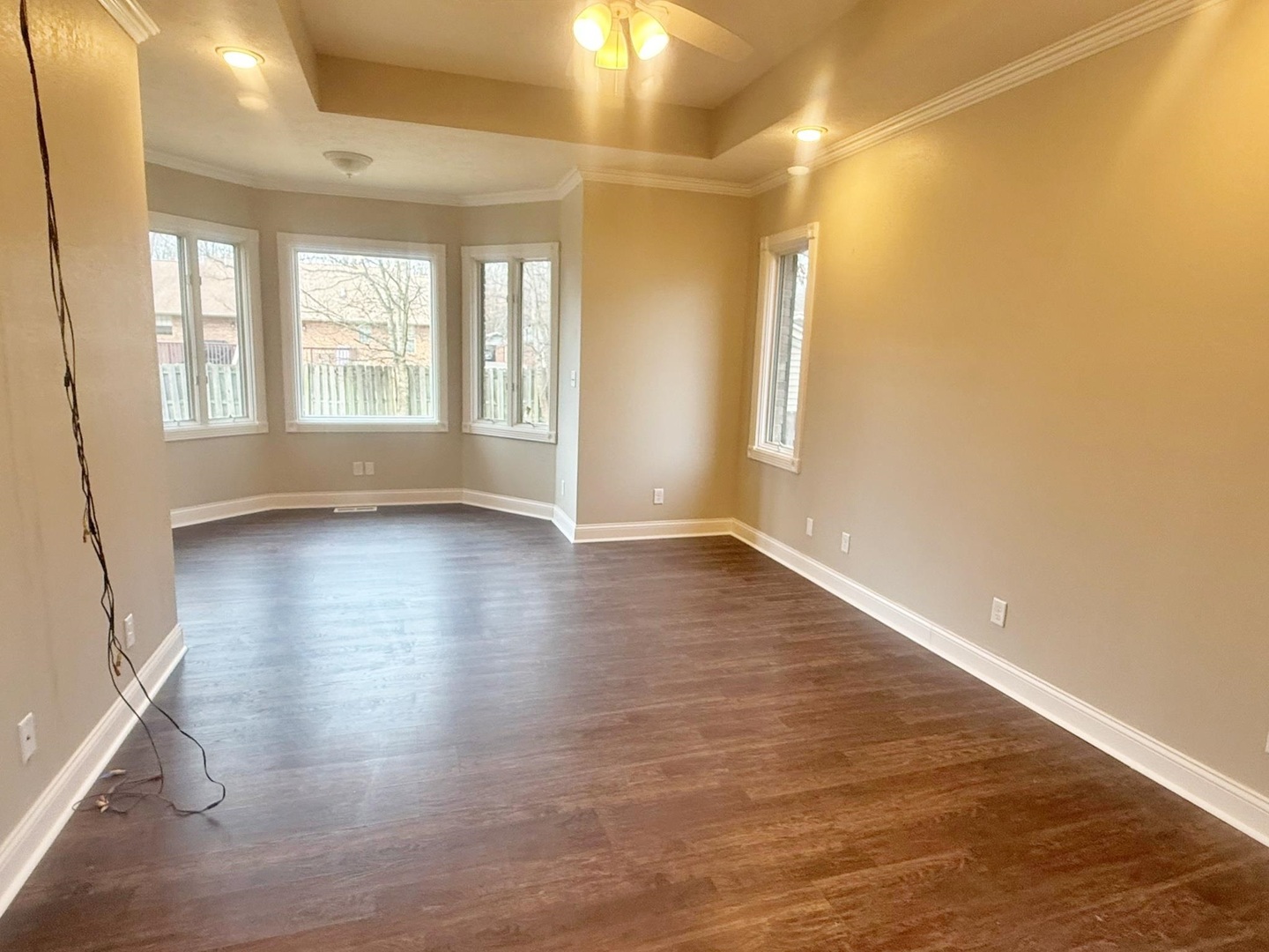 9 Hickory Lane Metropolis, IL 62960 - Photo 23 of 37 an empty room with wooden floor and windows