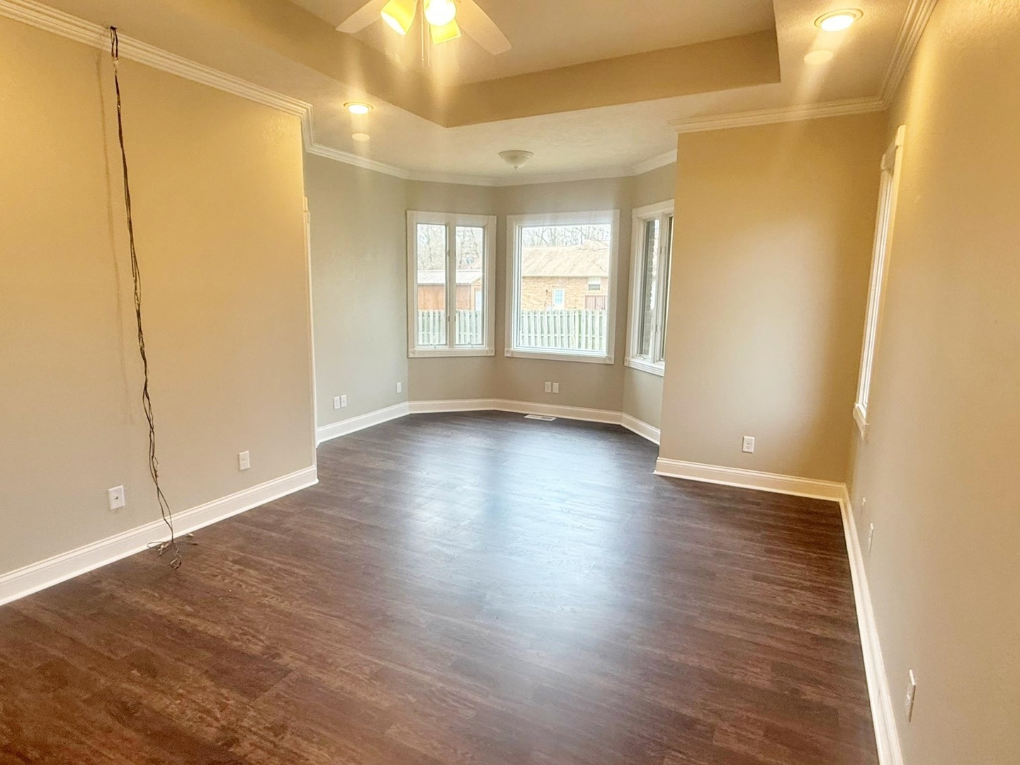 9 Hickory Lane Metropolis, IL 62960 - Photo 24 of 37 an empty room with wooden floor and windows