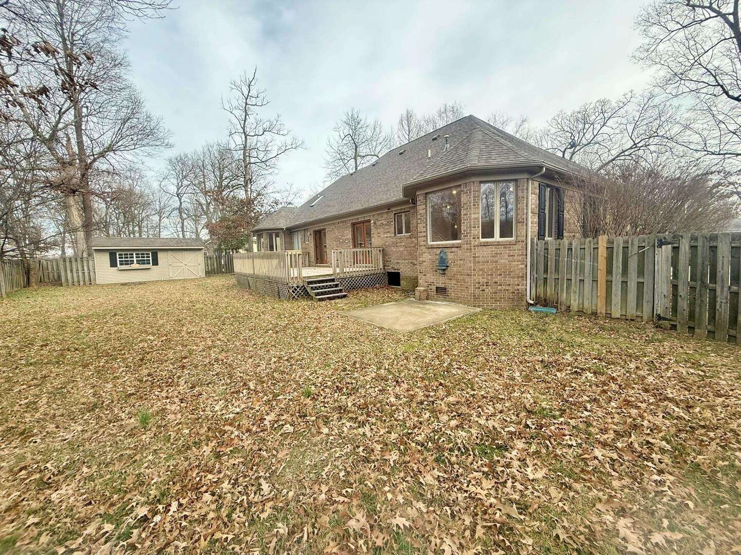 9 Hickory Lane Metropolis, IL 62960 - Photo 8 of 37 a front view of a house with a yard covered with snow and trees
