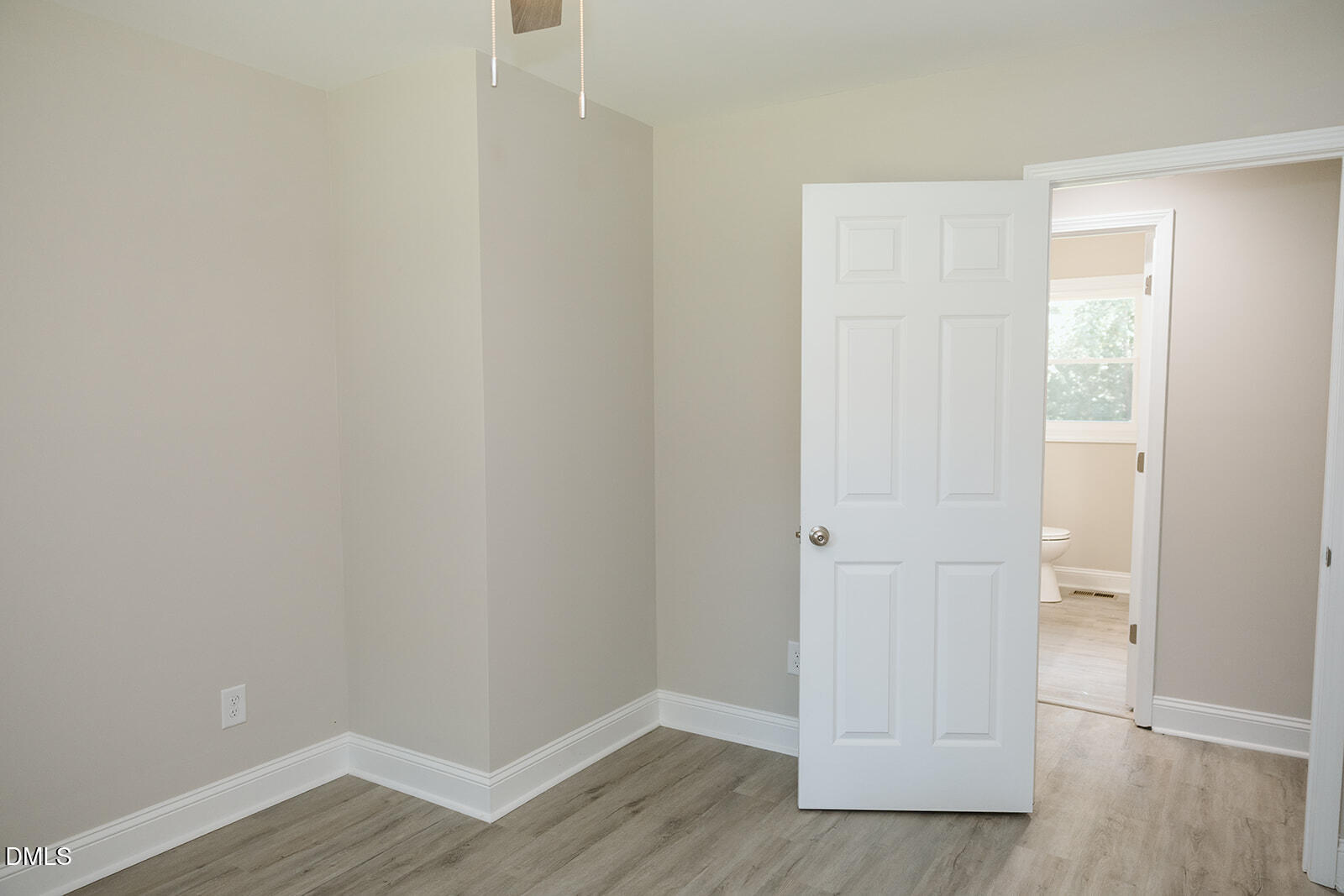 291 Knight Road Broadway, NC 27505 - Photo 12 of 18 a view of an empty room with wooden floor