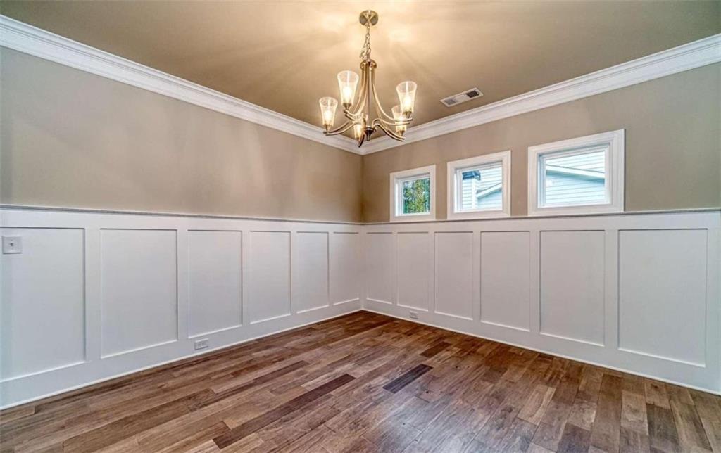 514 Adventure Trail Jefferson, GA 30549 - Photo 12 of 49 wooden floor in an empty room with a window