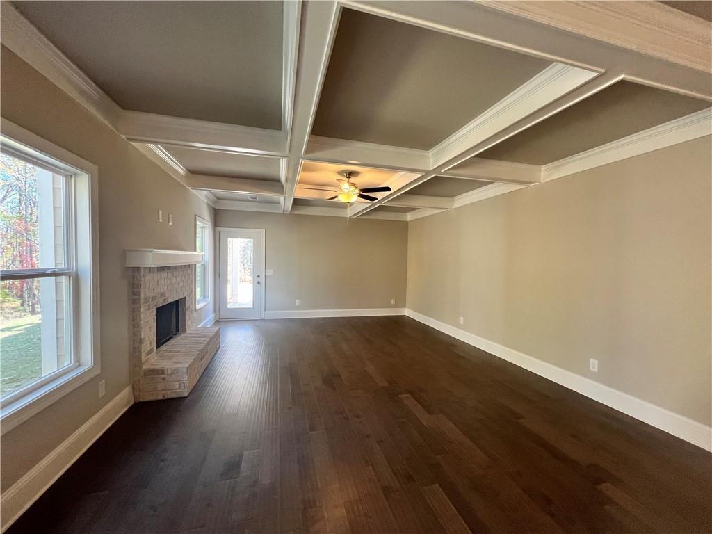 514 Adventure Trail Jefferson, GA 30549 - Photo 16 of 48 a view of empty room with fireplace and wooden floor
